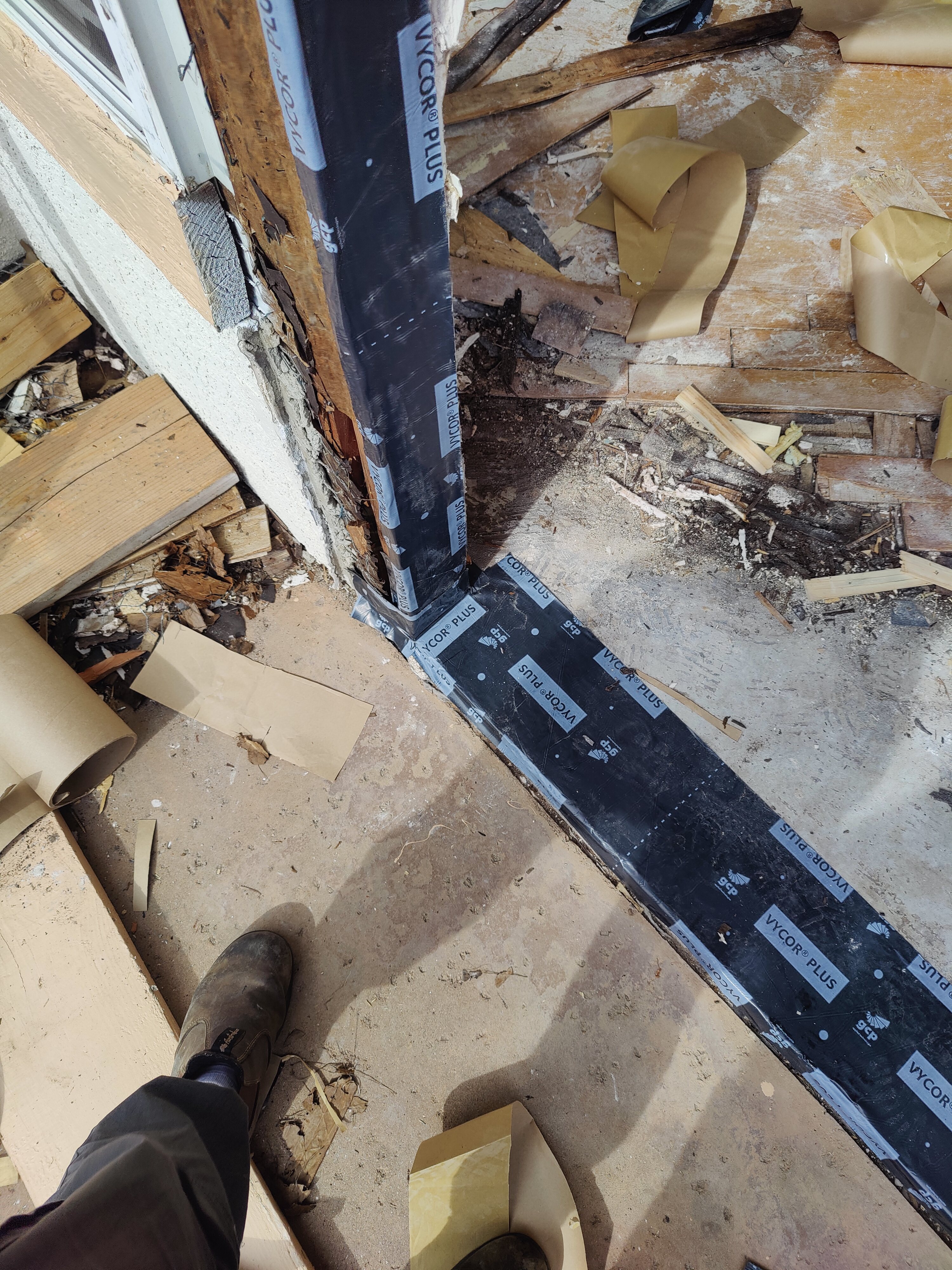 Door threshold waterproofing with membrane before new door installation