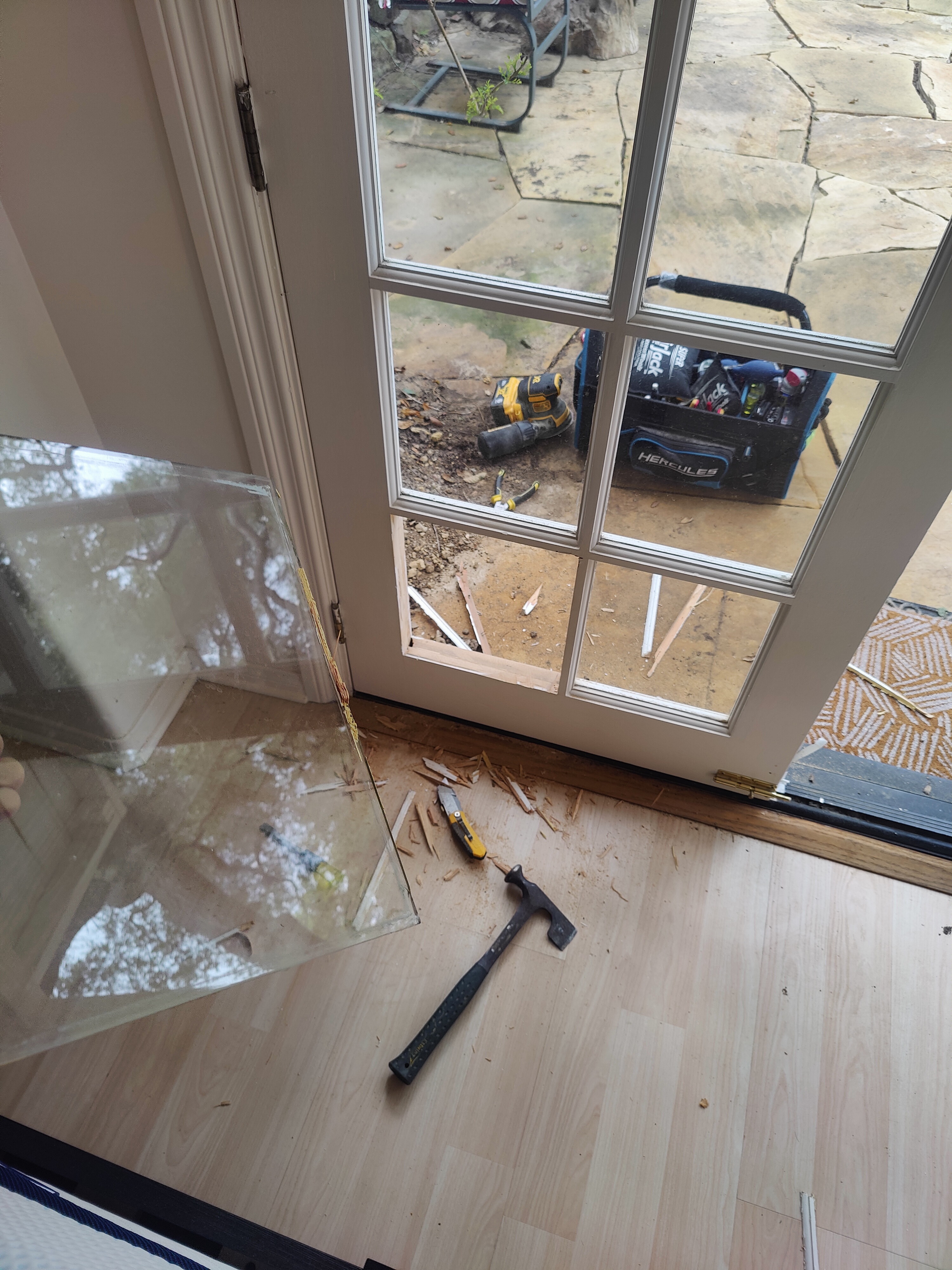 Cutting pet door opening into French door panel during installation