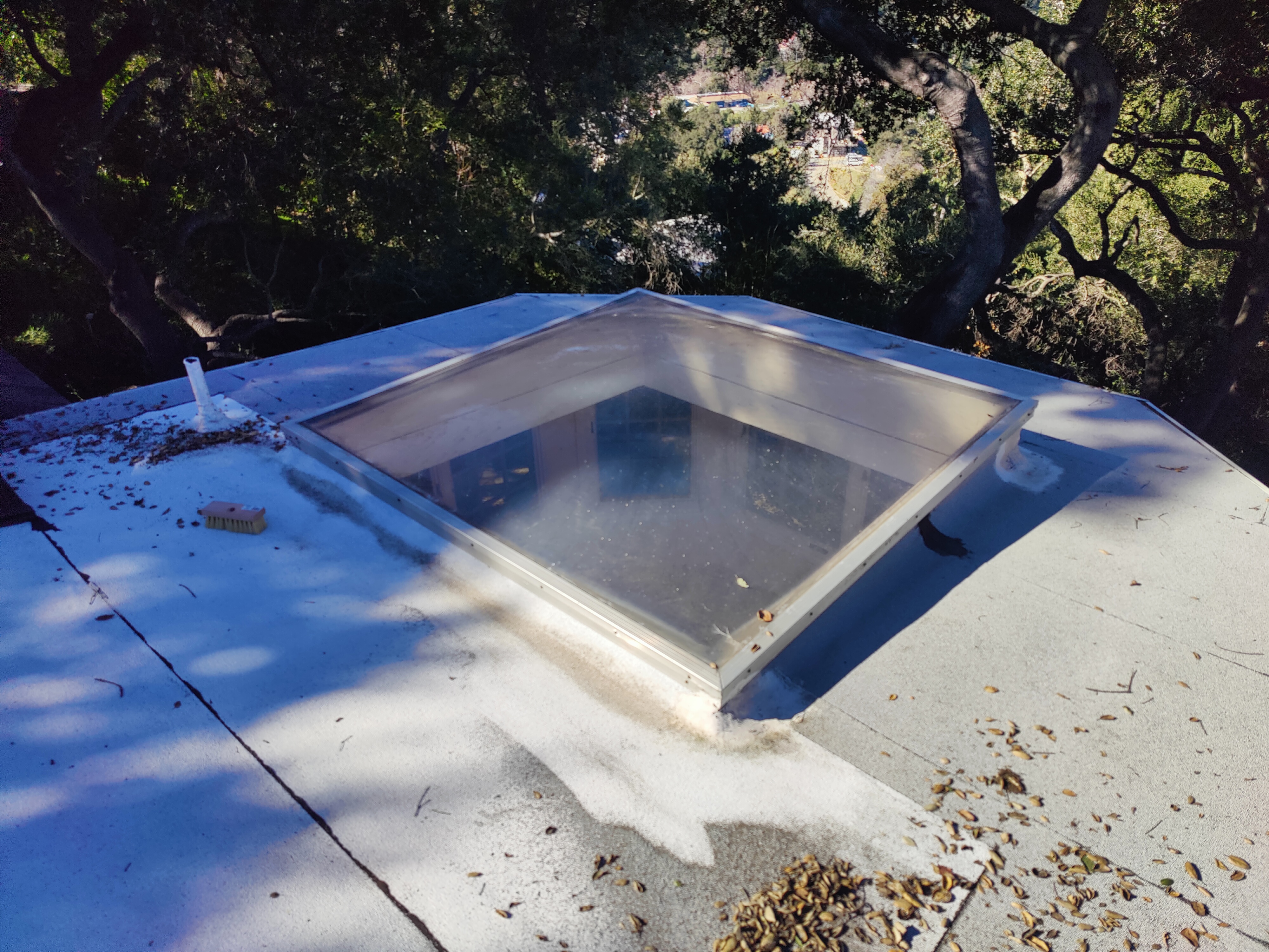 Skylight on flat roof before waterproofing repair