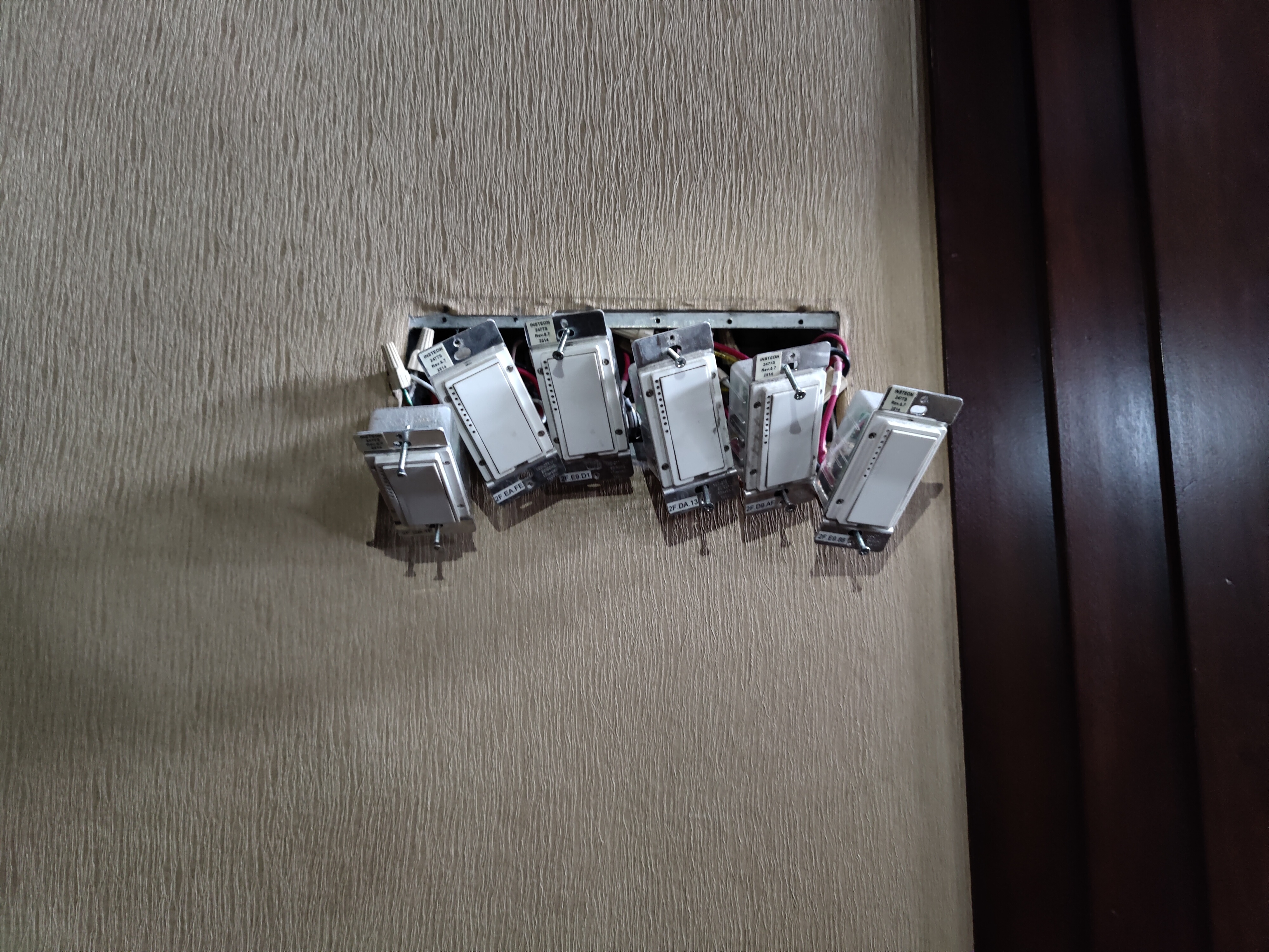 Insteon smart dimmer switches being installed in multi-gang electrical box